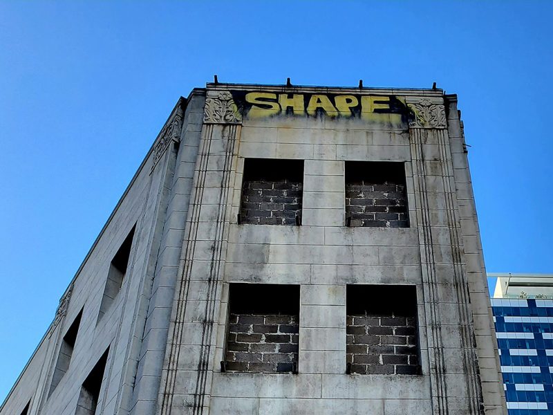 "Shape" written at the top a building across from Twitter in San Francisco.