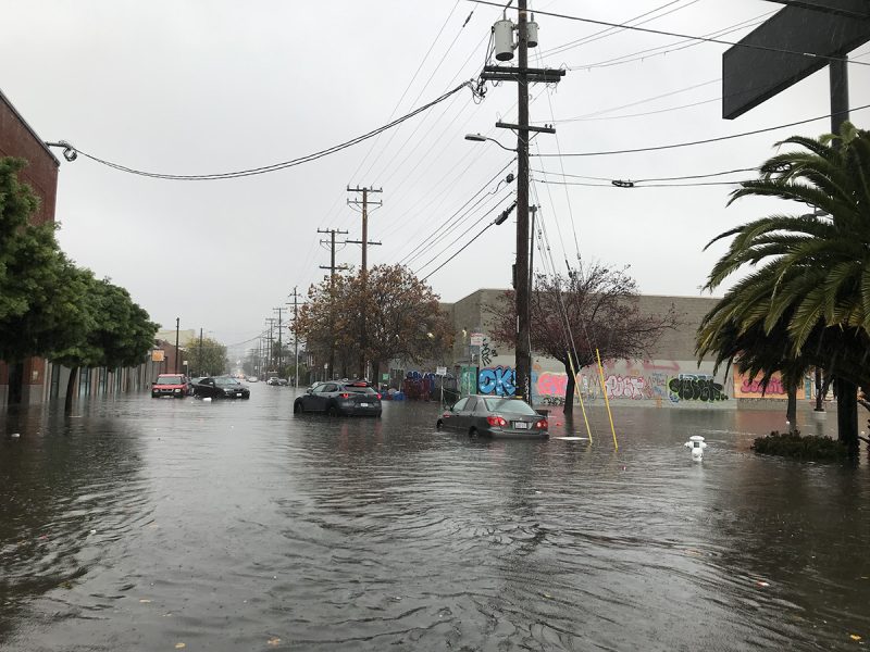 Cars in a flooded Street.