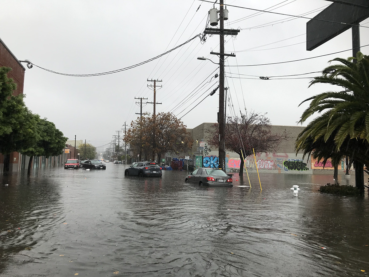 Cars in a flooded Street.