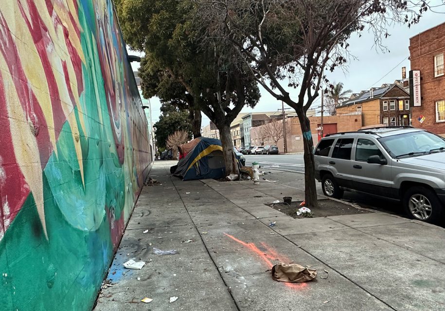 Harrison Street with tents at the end of the block.