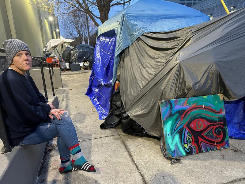 Amanda, 41, near her and her wife's tent on Alameda, behind Best Buy.