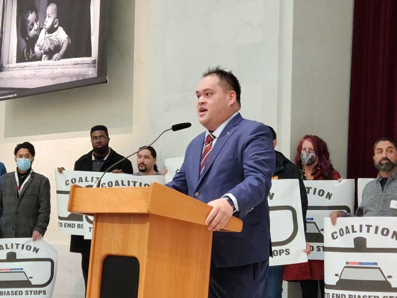 Police Commissioner Kevin Benedicto speaking at a lecturn.