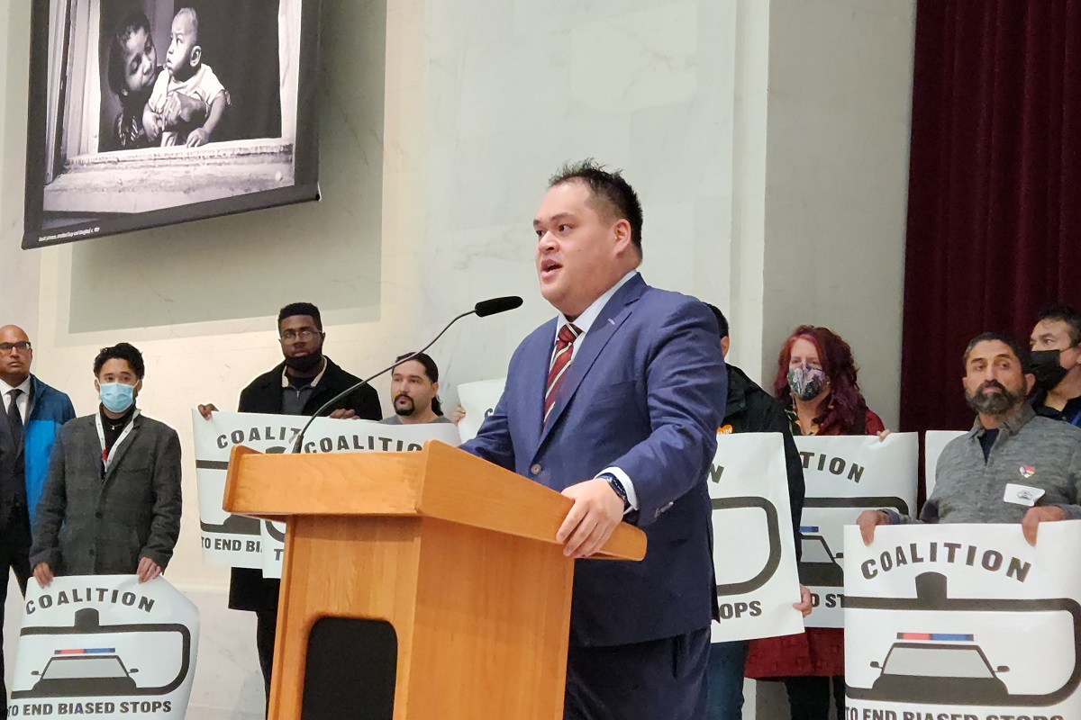 Police Commissioner Kevin Benedicto speaking at a lecturn.