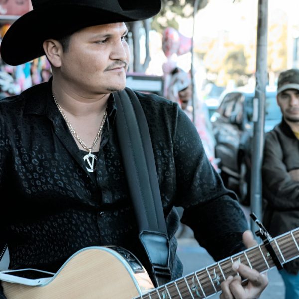 A man playing a guitar.