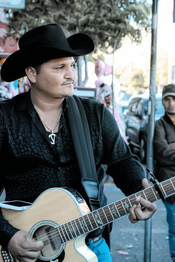 A man playing a guitar.