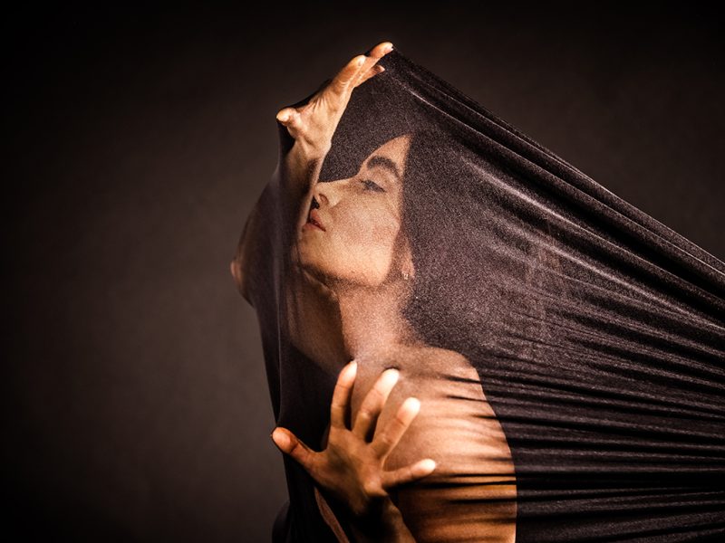 A woman's profile with her hair flowing behind her