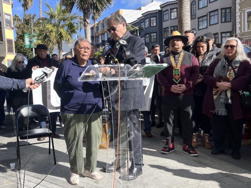 Two people speak at a press conference Mission violence Yolanda Melara Head Start mugging 16th Street BART Richard Ybarra
