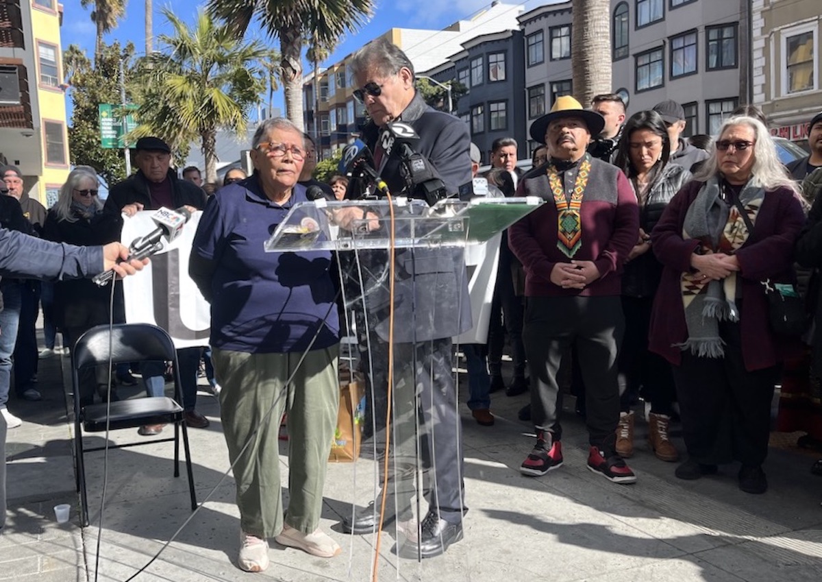 Two people speak at a press conference Mission violence Yolanda Melara Head Start mugging 16th Street BART Richard Ybarra