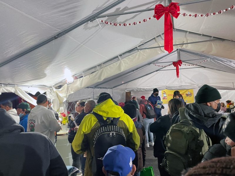 Last Friday night, a resource fair was presented by ten community organizations in the tented vaccination site at 24th and Capp. Photo by Christina MacIntosh.