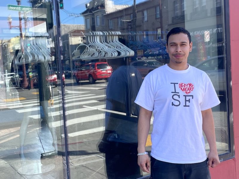 Man in front of shop window