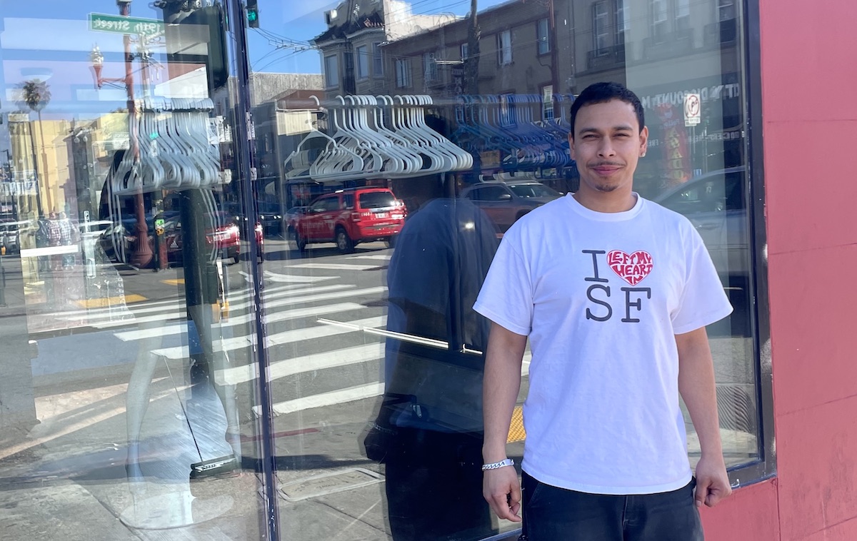 Man in front of shop window