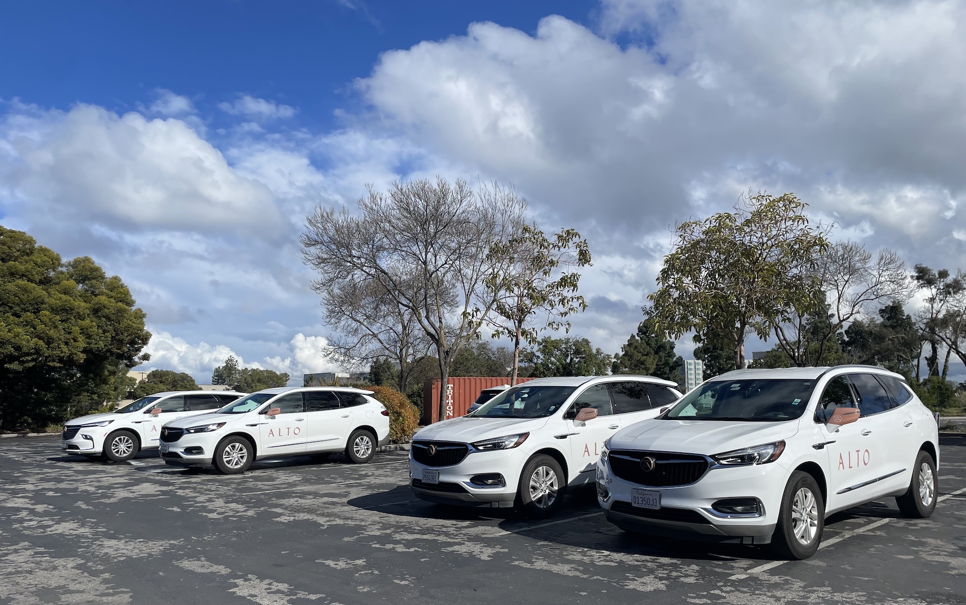 A few cars in a parking lot