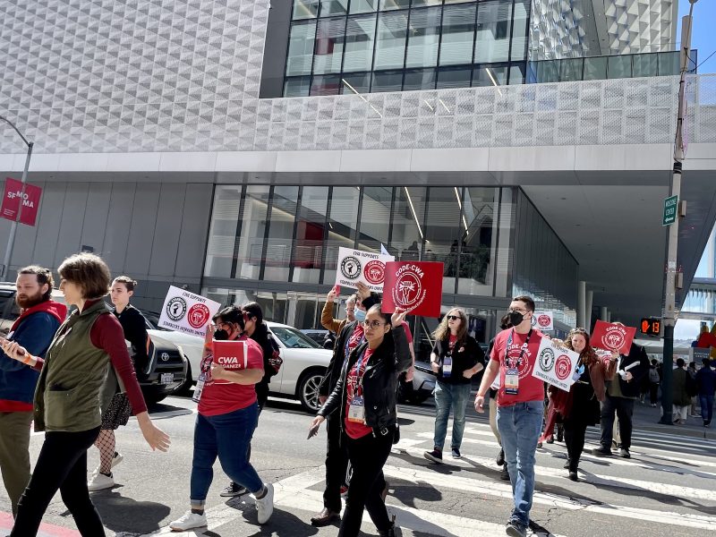 A group of people crossing the street