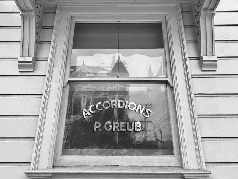 A window in a victorian with stenciled, Accordian B Grubb