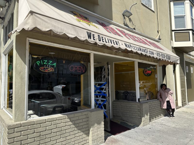 Storefront with smashed glass door