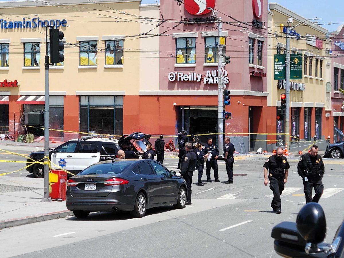 cars and police in front of a crash scene