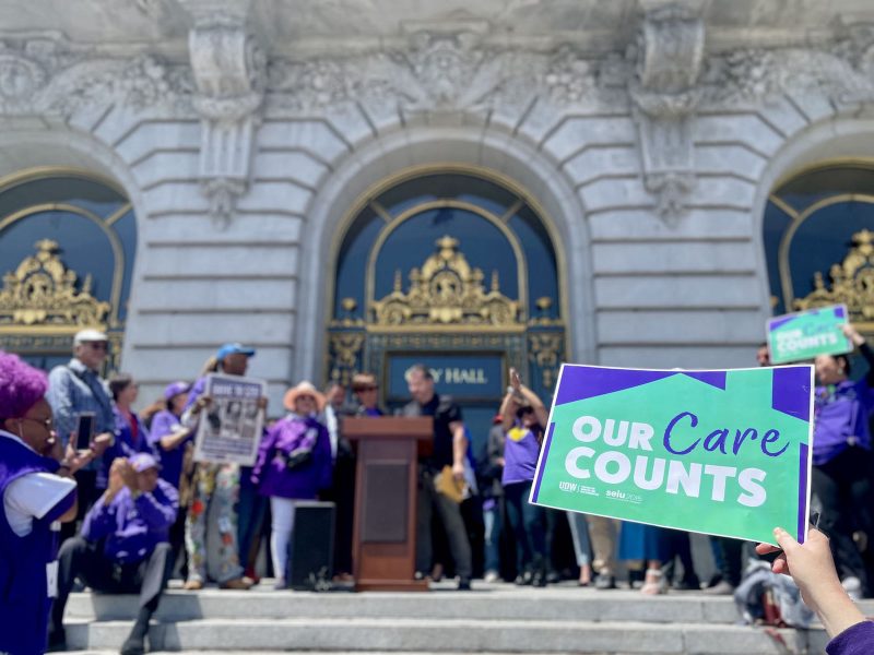 A poster and a group of people