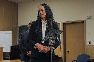 A photo of a woman at the Hall of Justice.