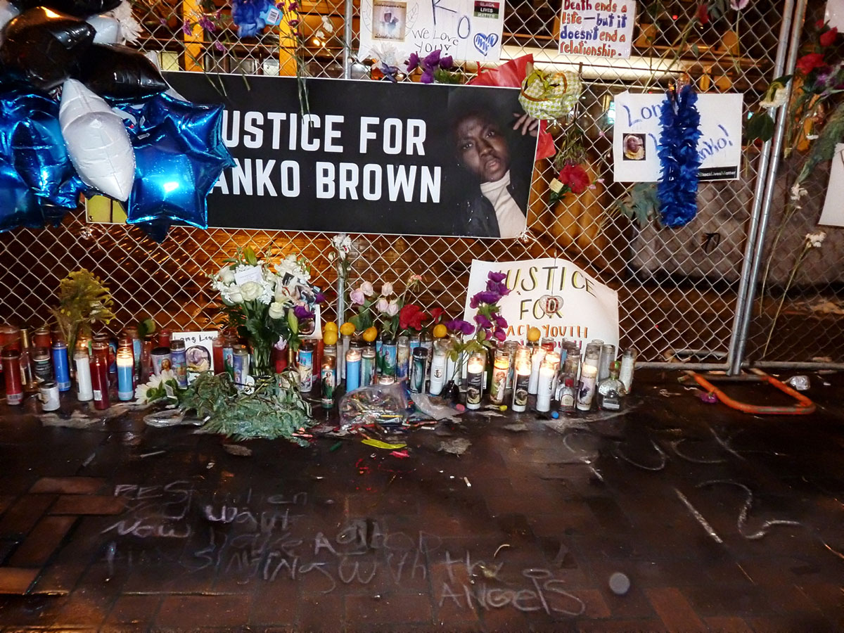 A memorial with candles and banners for Banko Brown.