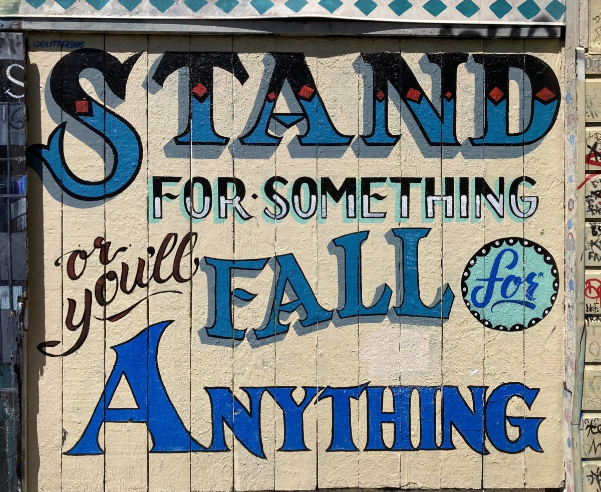A sign with a motto in script: Stand for something or Fall for anything.