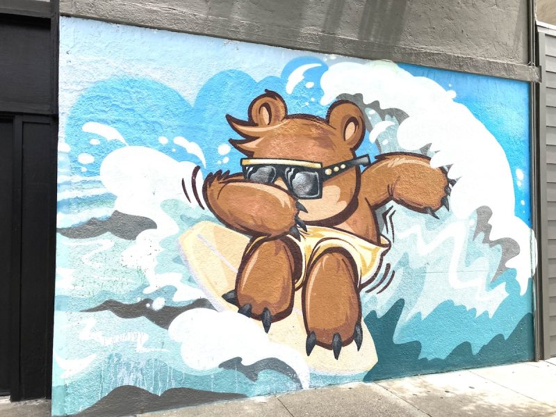 mural of a surfing bear