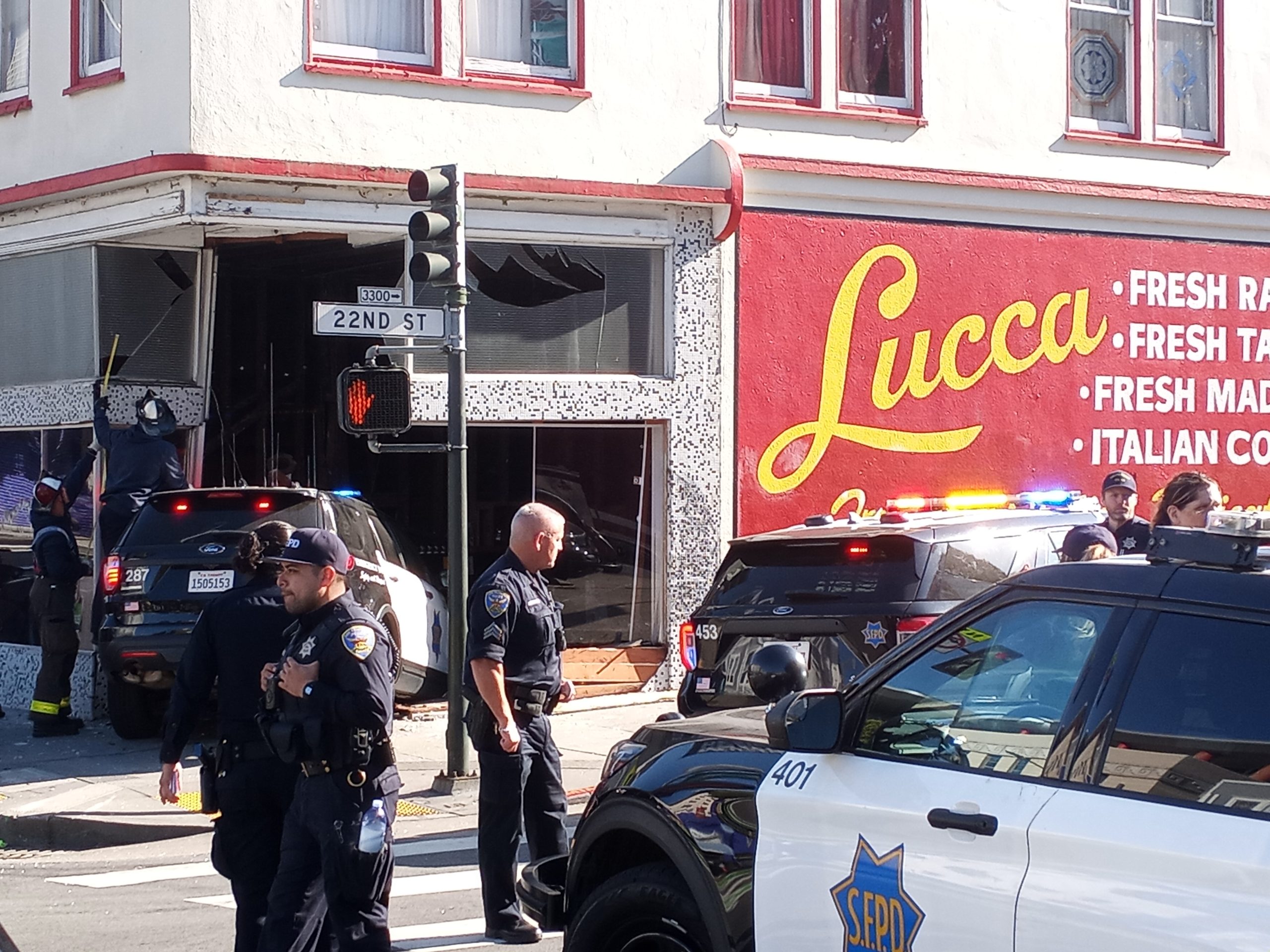 police SUV crashed into Lucca, firefighters and police officers standing nearby