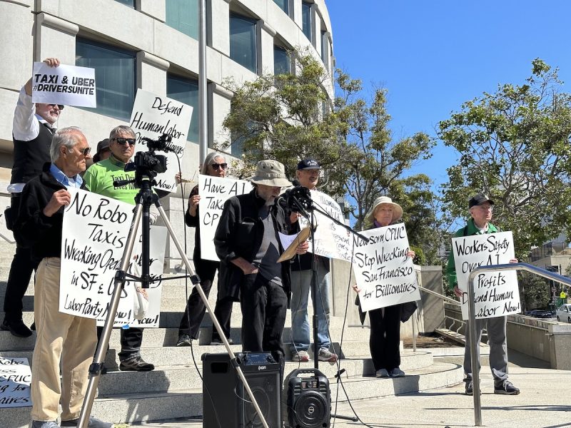 protester at waymo/cruise protest giving a speech