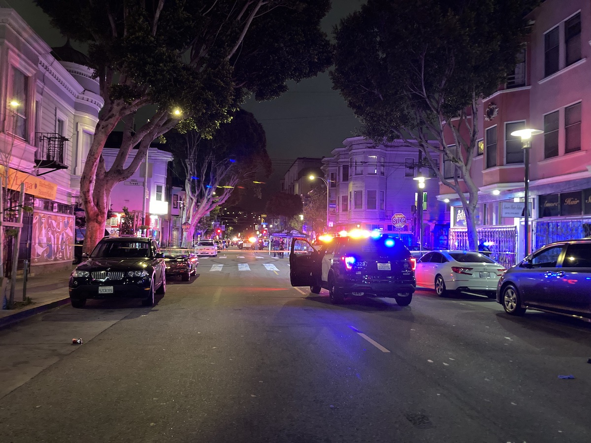 police car in the middle of 24th Street