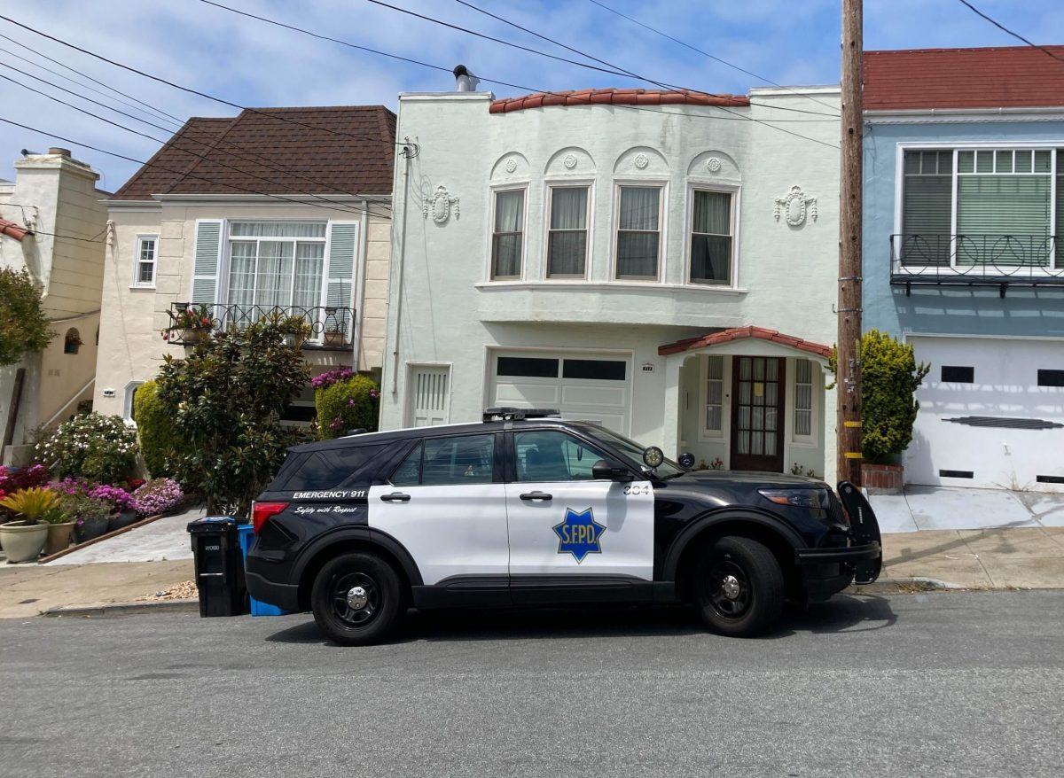 sfpd suv parked in front of two story house