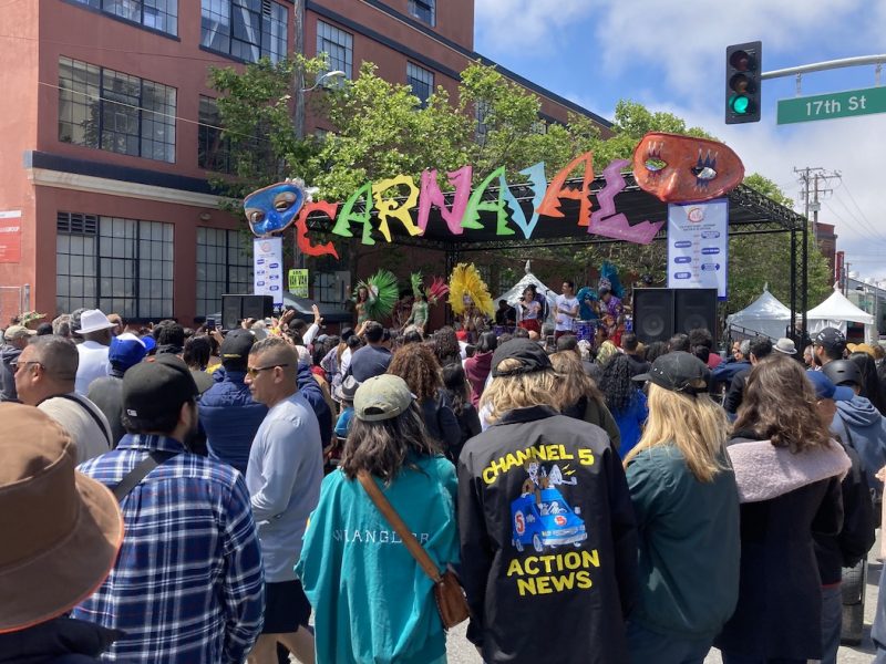 a crowd on the street for Carnaval