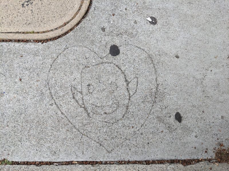 etched elf and heart in concrete