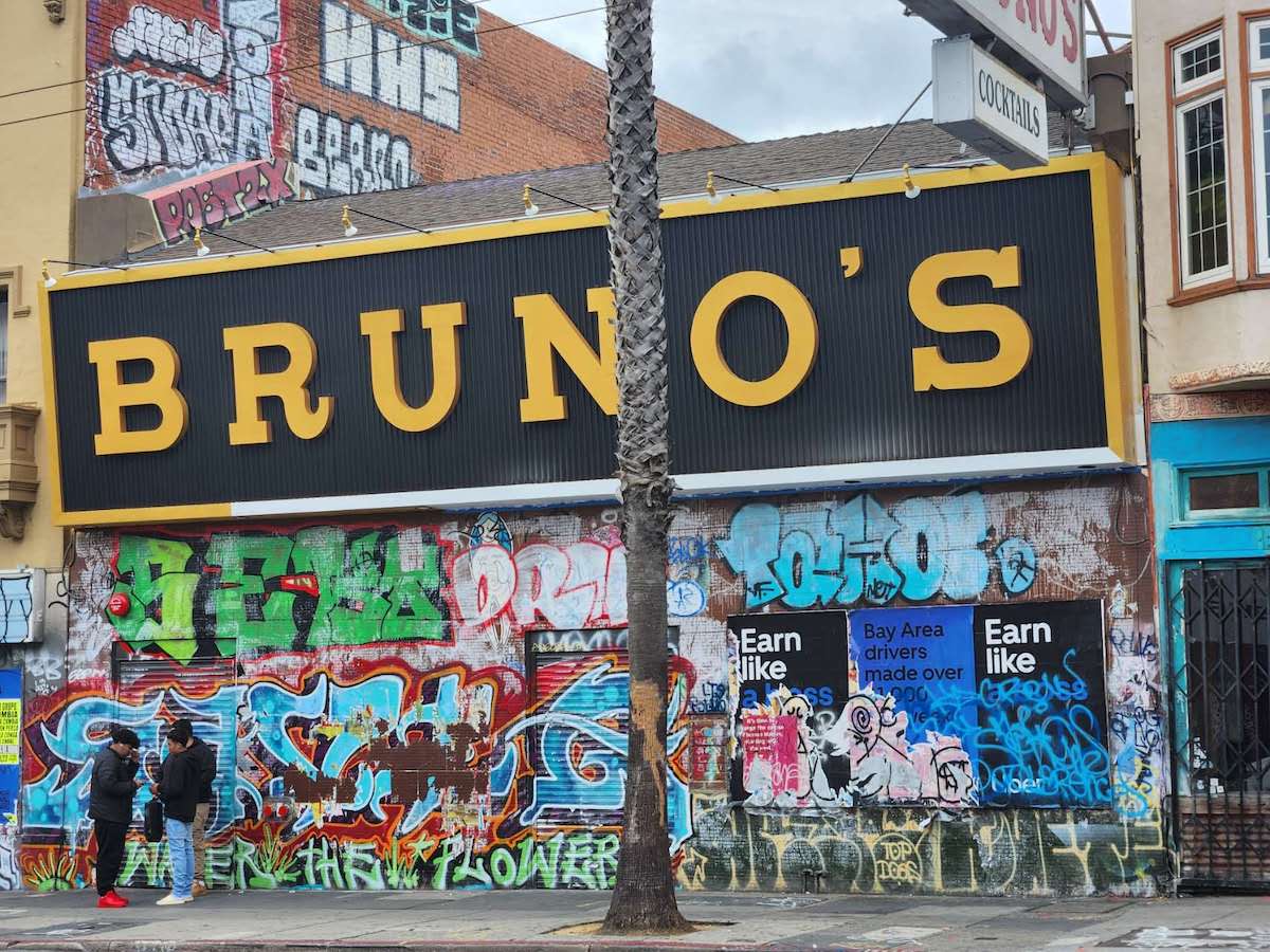 storefront with large latters and graffiti