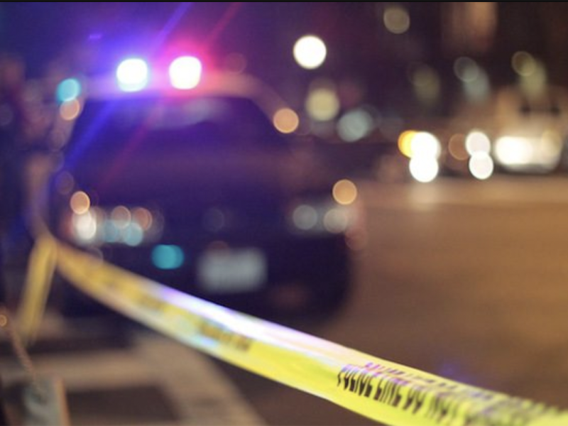 Police car and yellow tape. File photo