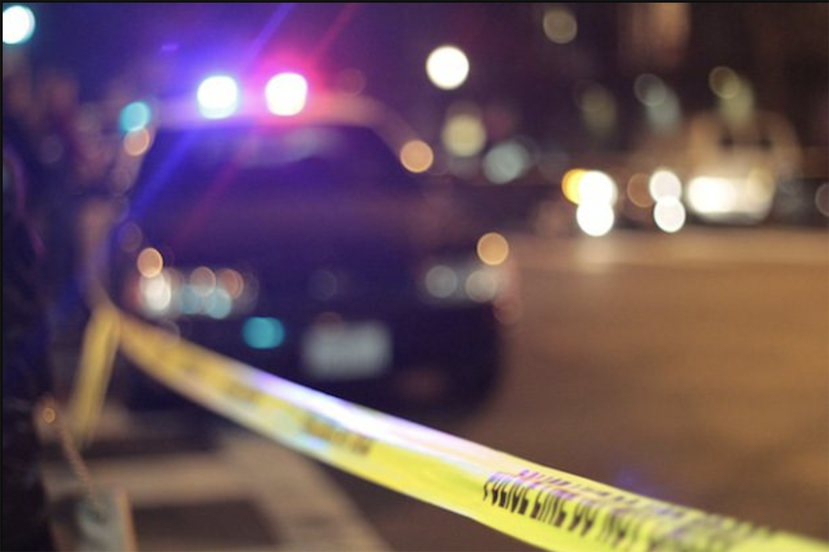 Police car and yellow tape. File photo
