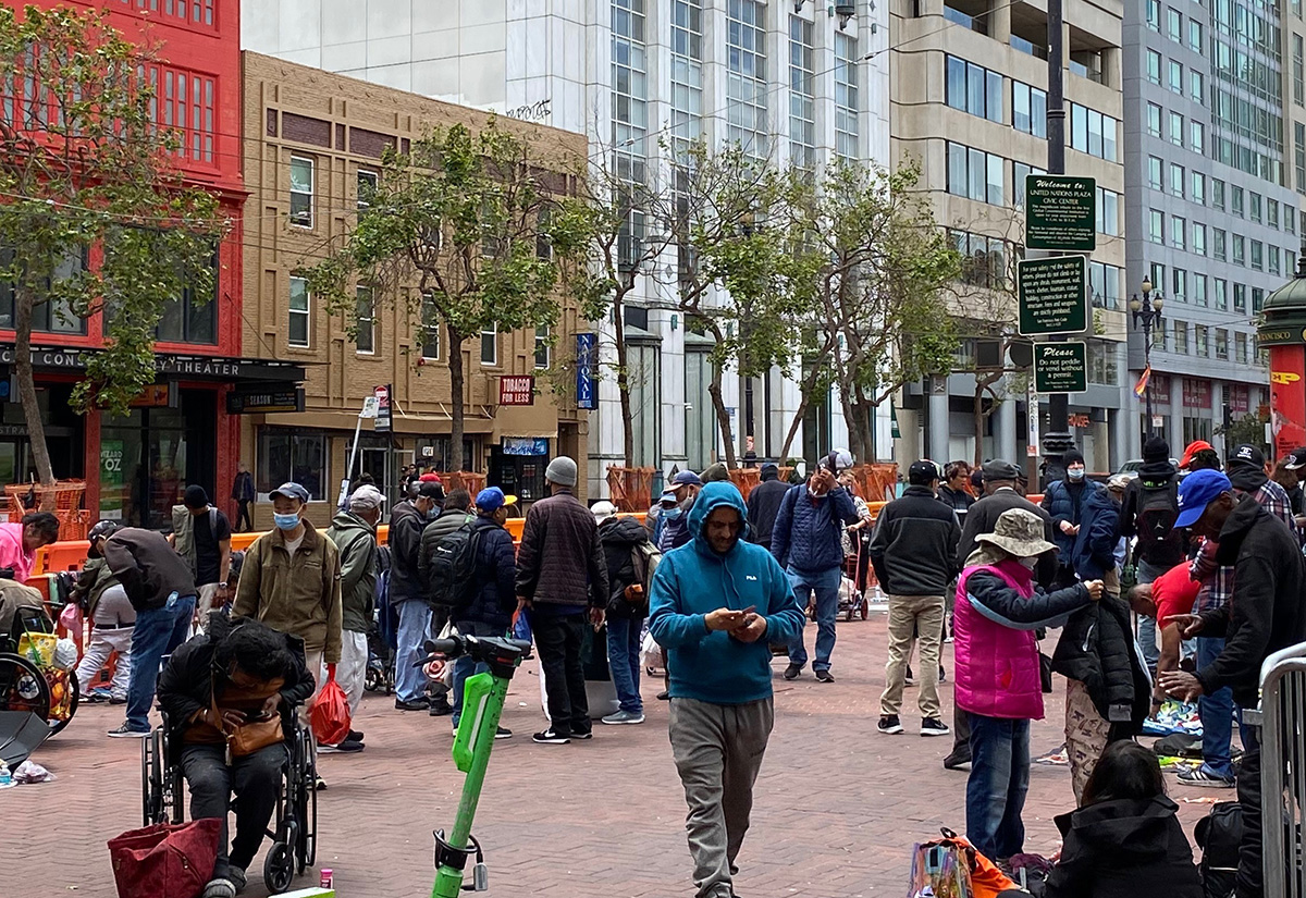 a group of peole in the plaza