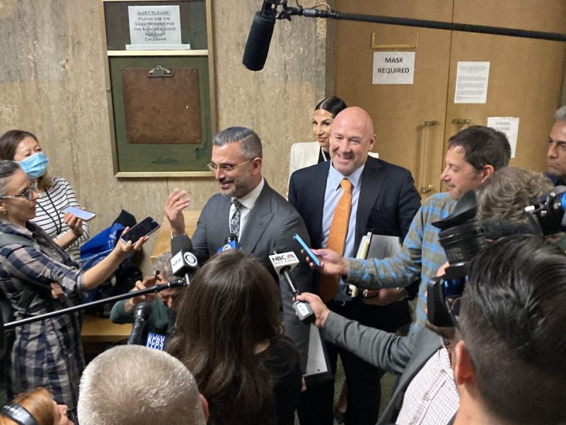 Saam Zangeneh and Bradford Cohen, Nima Momeni's criminal attorneys, standing in a press scrum on day one of the preliminary hearing.
