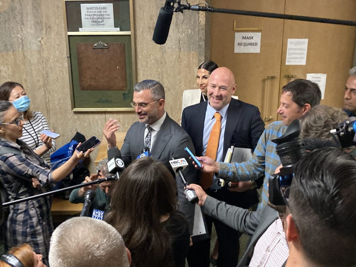 Saam Zangeneh and Bradford Cohen, Nima Momeni's criminal attorneys, standing in a press scrum on day one of the preliminary hearing.