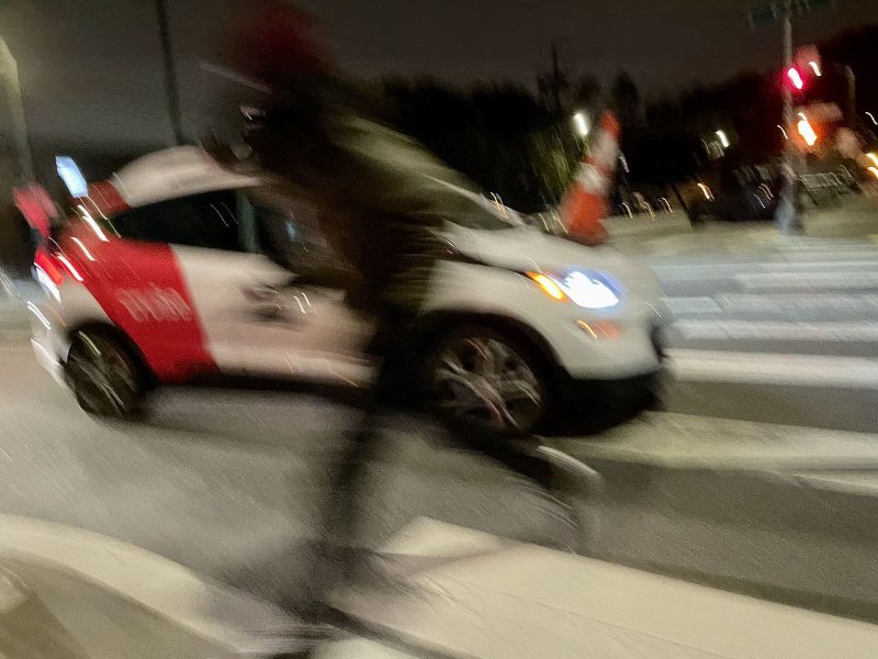 A person running away from the middle of a street