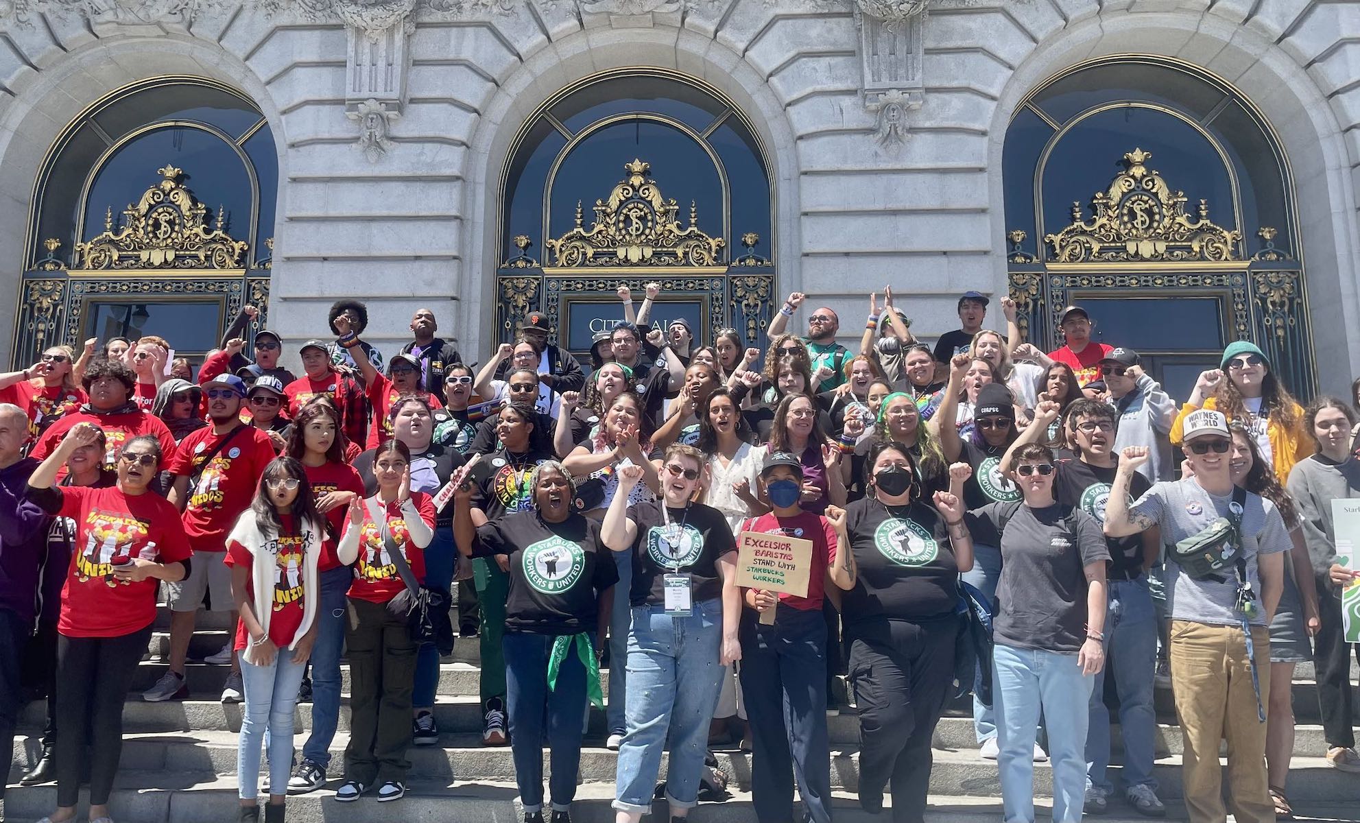 A large group of people in front of a building.