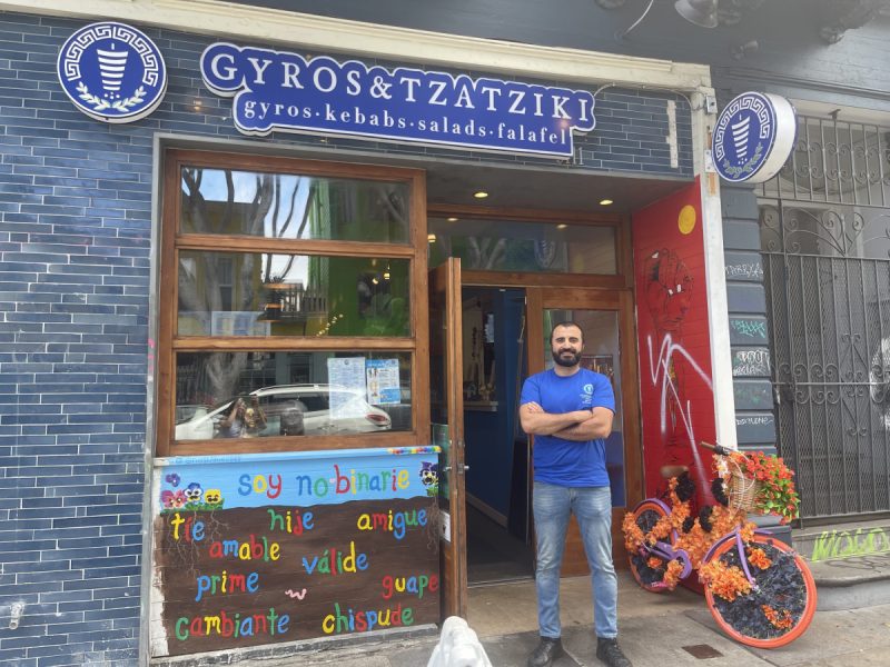 Cem Bulutoglu poses proudly in front of his restaurant on 24th.