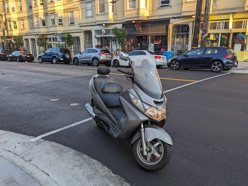 A motorcycle without a driver at an intersection