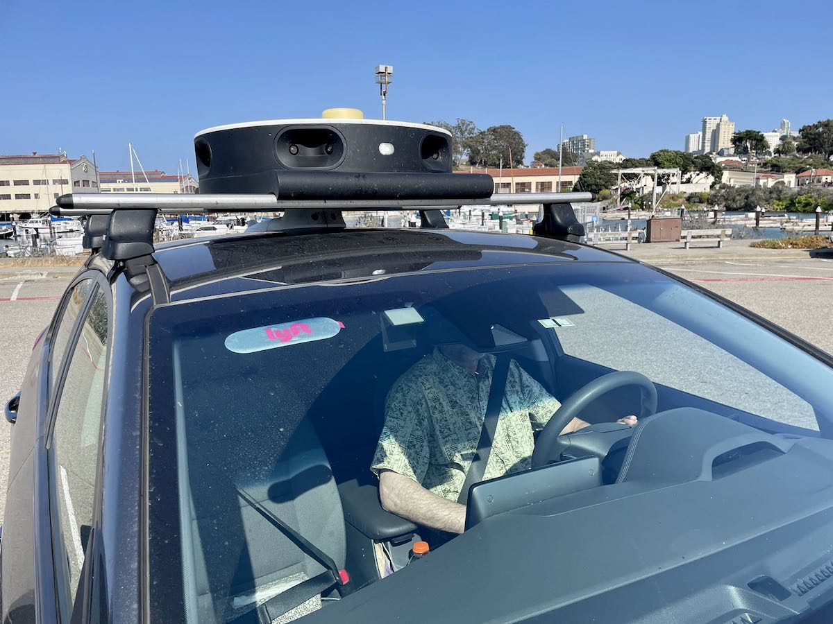 A driver sitting inside a vehicle