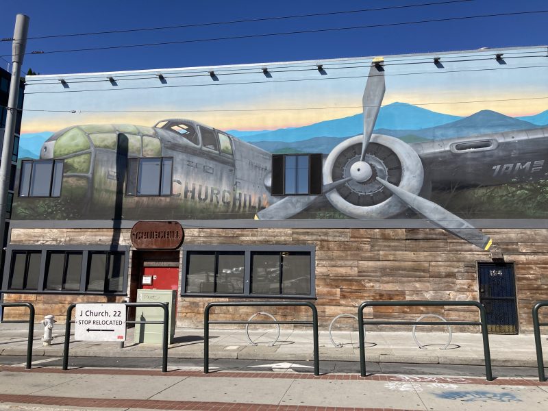 A mural of a plane that says Churchill on the side
