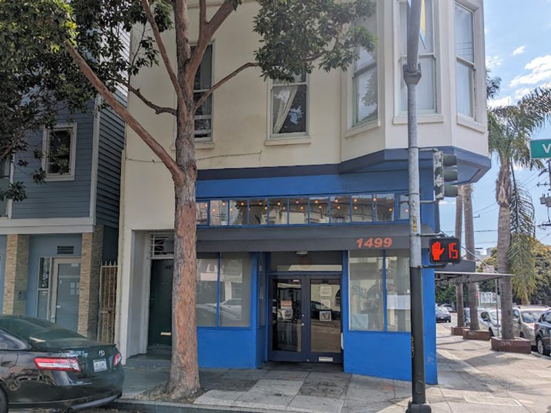 The outside of a restaurant, painted blue