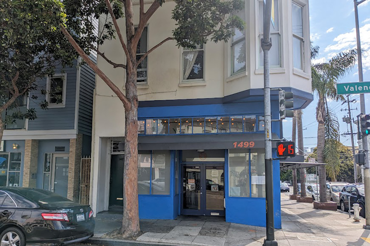 The outside of a restaurant, painted blue