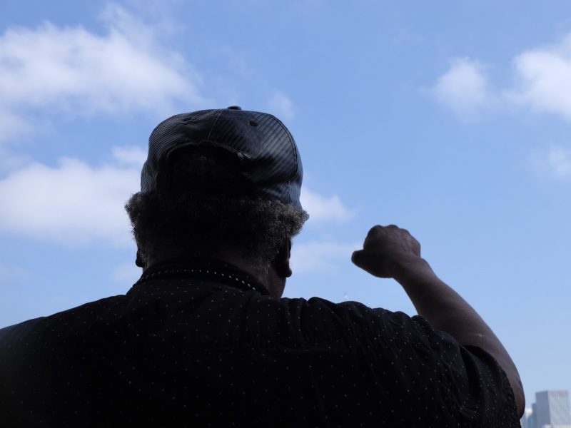 A person clenching his fist in solidarity