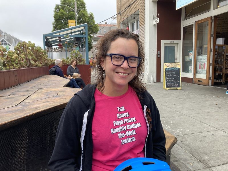 a woman in a pink t-shirt