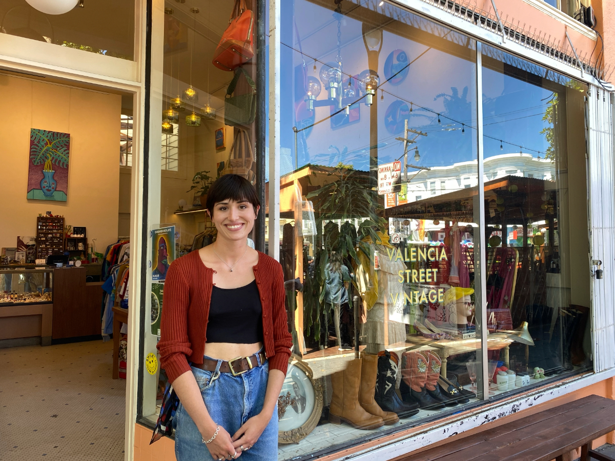 Shaelyn Dalziel standing by the door of Valencia Street Vintage