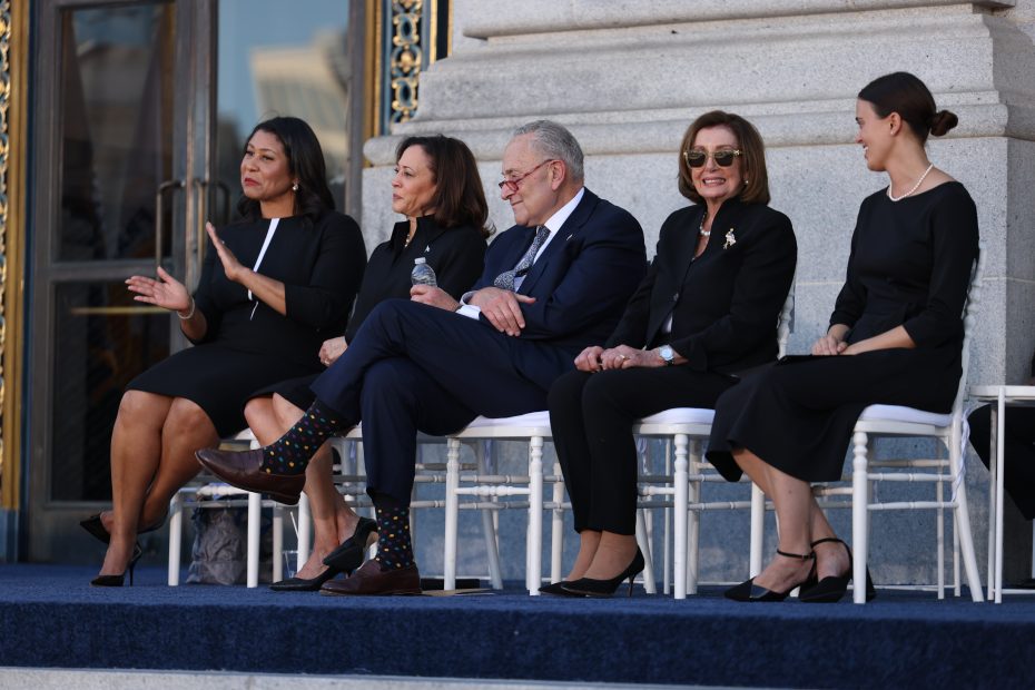 a group of people sitting in front of city hall