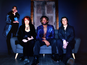 A group of people sitting on a couch.